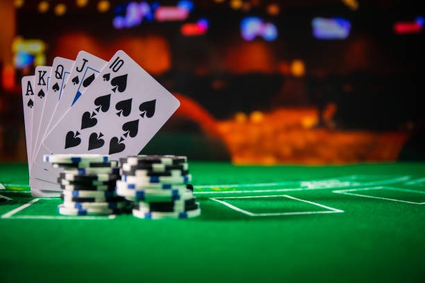 kapten 69 AduQ croupier broadcasting live card game from professional studio with multiple players